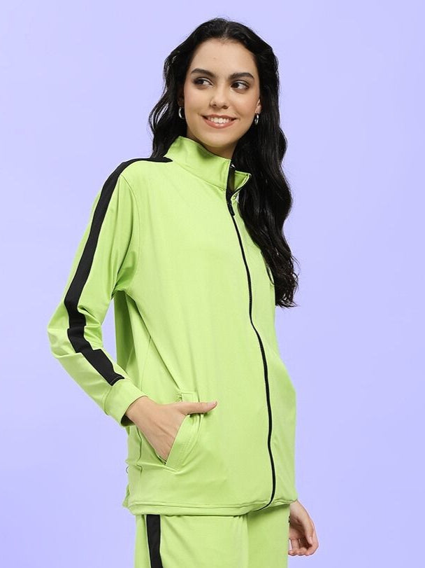 Woman wearing WOMEN HIGH PERFORMANCE JACKET NEON GREEN, stylish neon green jacket ideal for active lifestyles and outdoor activities.