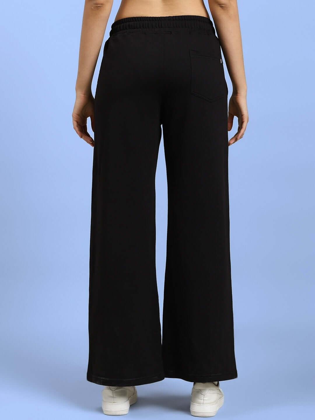 Back view of WOMEN'S HOLLISTER JOGGERS BLACK showcasing wide-leg design and elastic waistband, suitable for custom fit options.