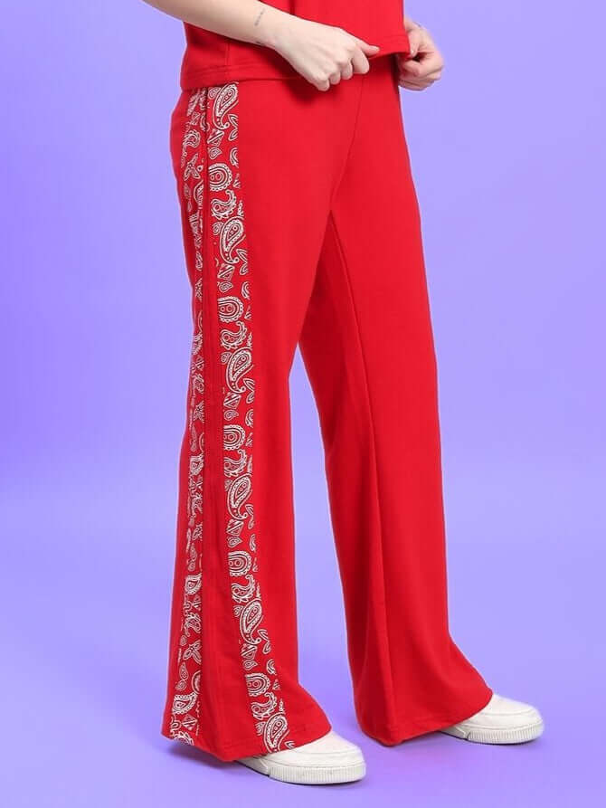 Red women's relaxed fit joggers with side paisley print, comfortable and tailor-made for a custom fit, by DUDS.