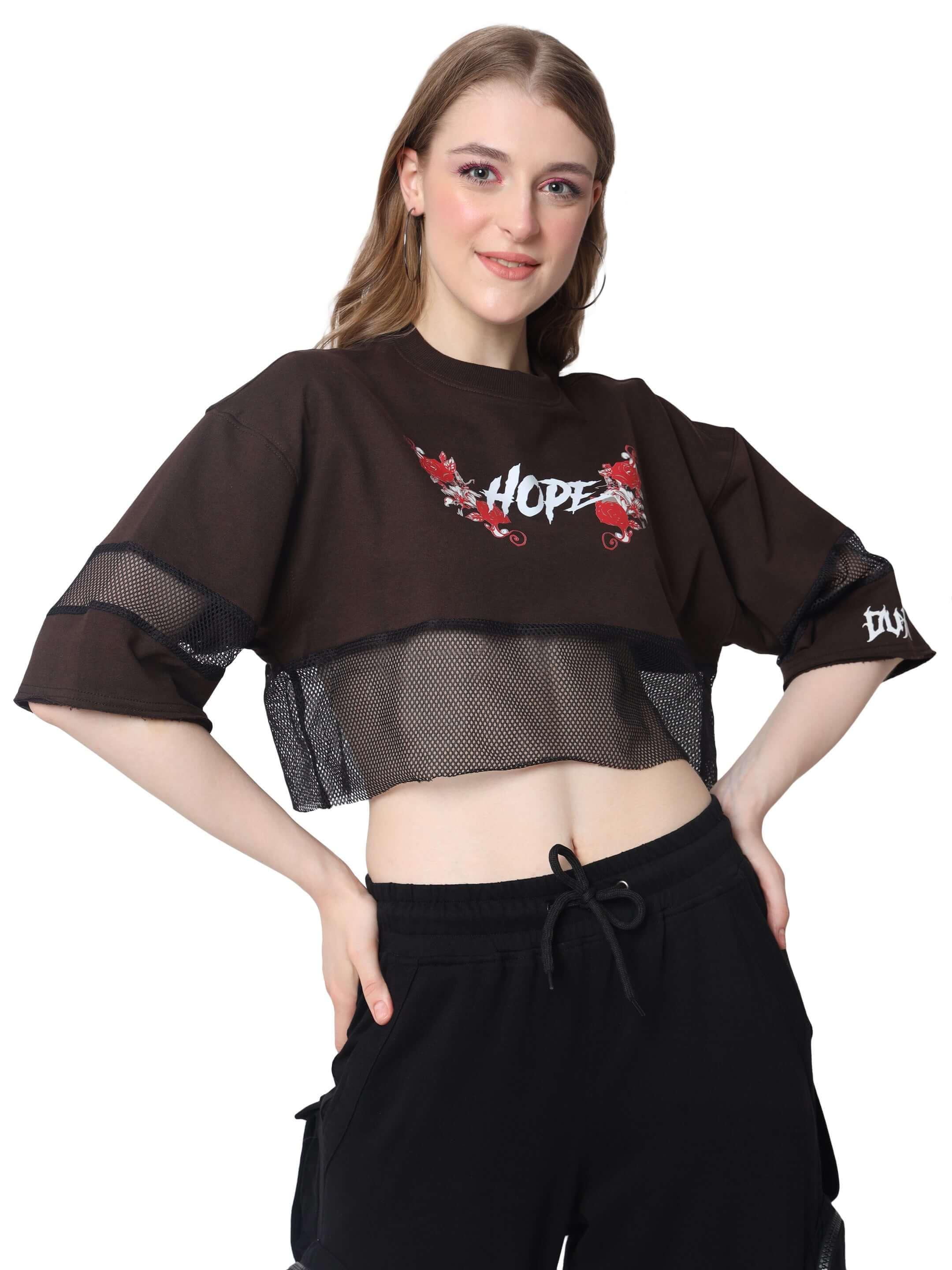 Model wearing Women's Hope Oversized Cropped T-shirt in brown color, featuring premium cotton fabric and stylish design.
