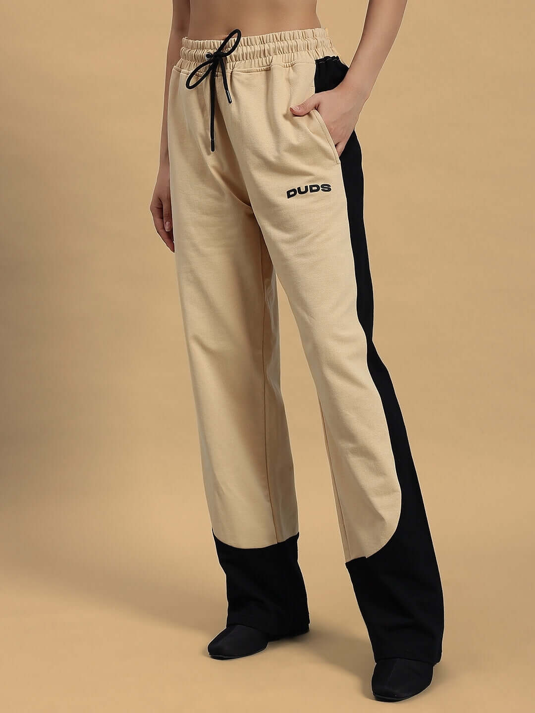 Beige-black Women's Hurtle Baggy Joggers by DUDS, showcasing elastic waistband and relaxed fit. Available for custom sizing.
