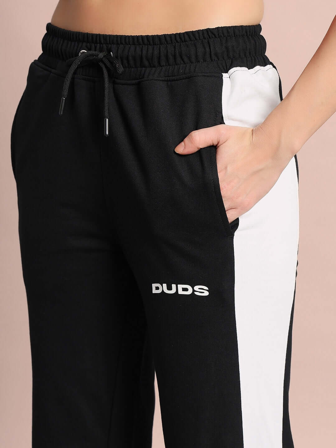 Close-up of Women's Hurtle Baggy Joggers in black with white accents, featuring a comfortable fit with drawstring waist by DUDS.