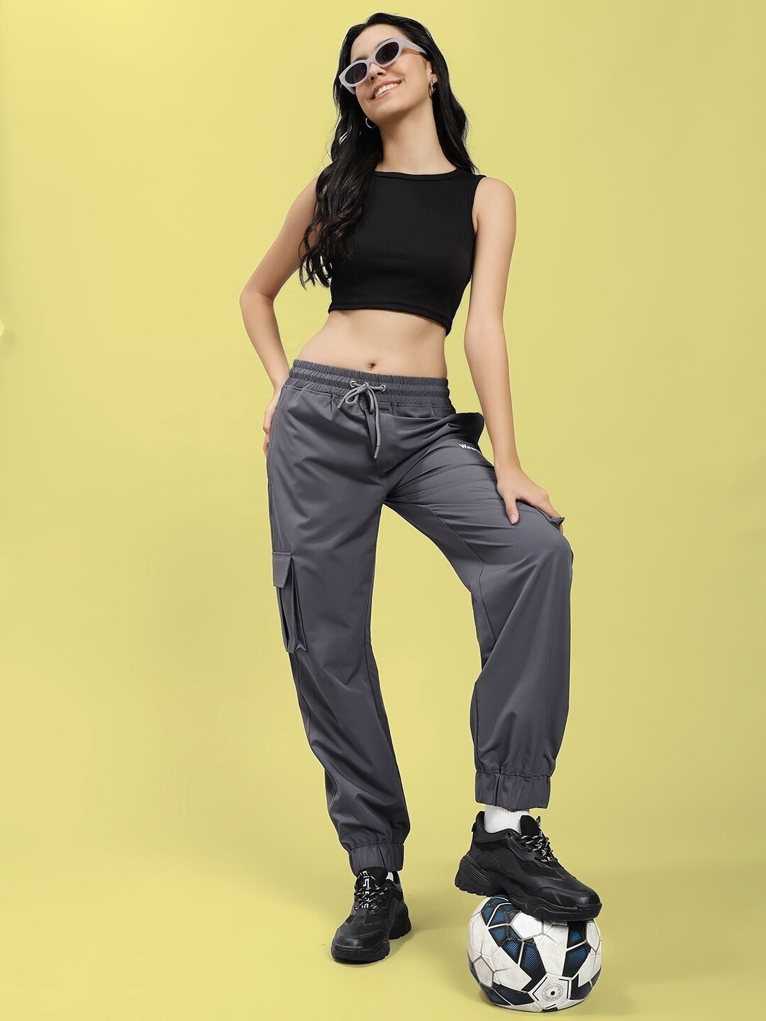 Woman wearing WOMEN'S JACK RELAXED FIT MULTI POCKET CARGO DARK GREY, casual style with a soccer ball
