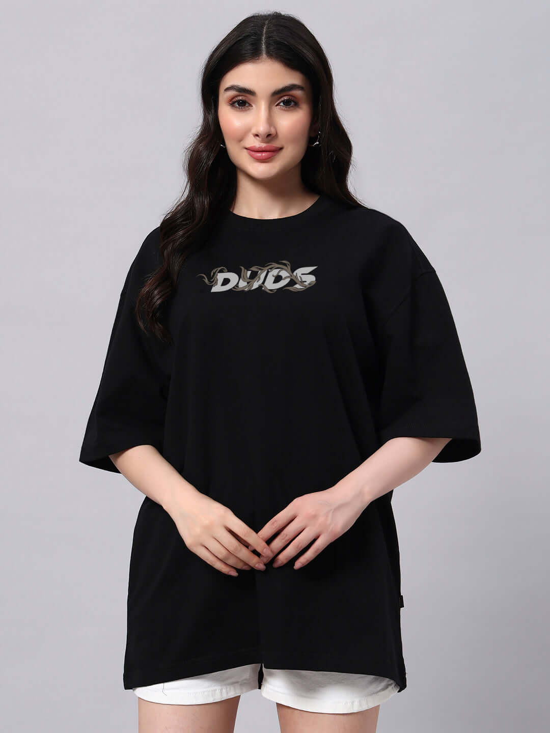 Model wearing black oversized women's Jelvin T-shirt, premium cotton French Terry, 97% cotton, 3% elastane, 240 GSM, India-made.