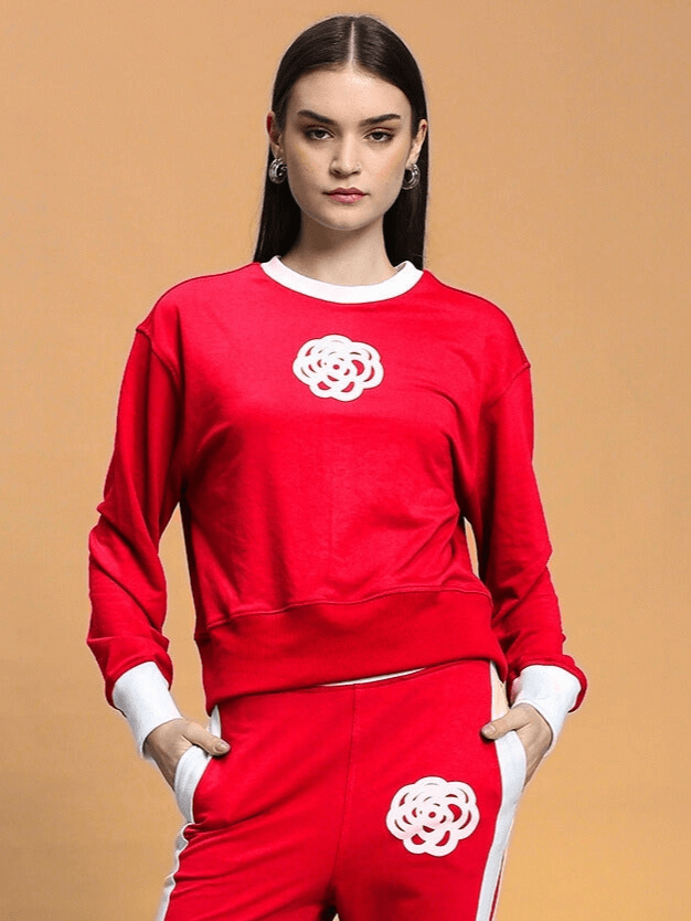 Woman wearing red Women's Jessflick Relaxed Fit Sweatshirt with floral design, made from premium cotton terry lycra blend.