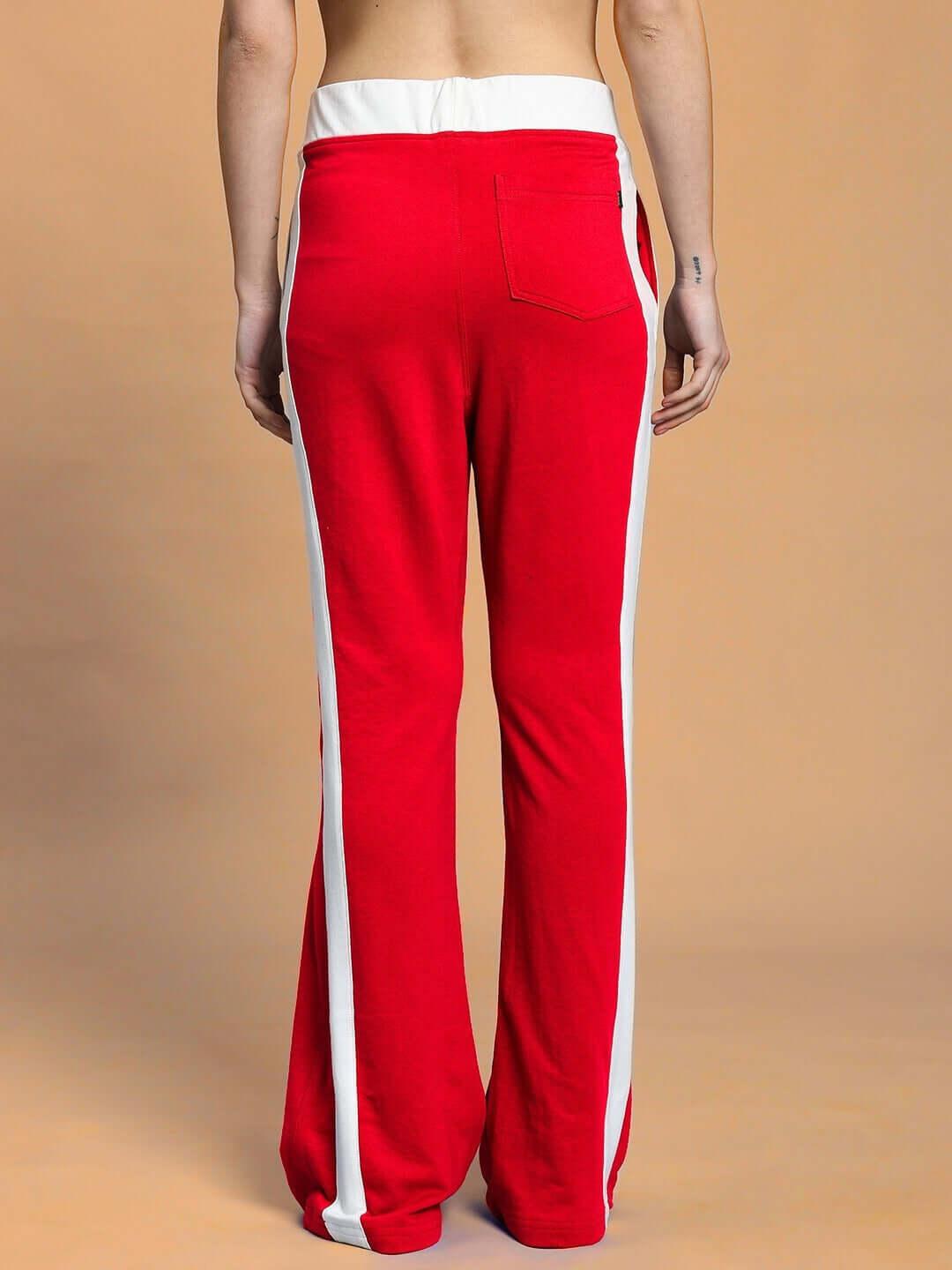 Back view of women's Jessflick relaxed fit jogger in red with white stripes, showcasing casual comfort and style.