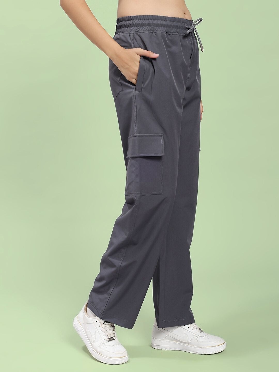 Model wearing WOMEN JIMMY RELAXED FIT MULTI POCKET JOGGER DARK GREY showcasing modern joggers with multi-pocket design and relaxed fit.