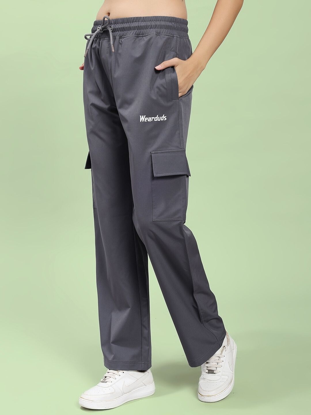 Model wearing WOMEN'S JIMMY RELAXED FIT MULTI POCKET JOGGER DARK GREY, featuring a relaxed style and multiple pockets for versatility.