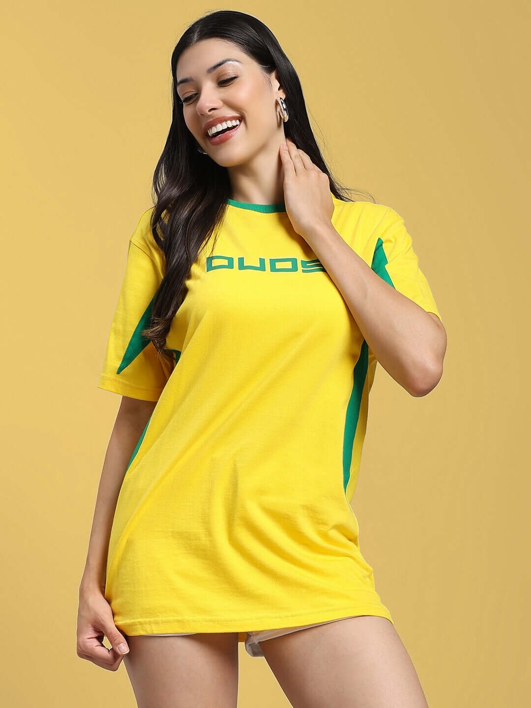 Woman wearing a yellow-green regular fit t-shirt made from 100% cotton, designed by Color By Colours, showcasing a modern and stylish look.