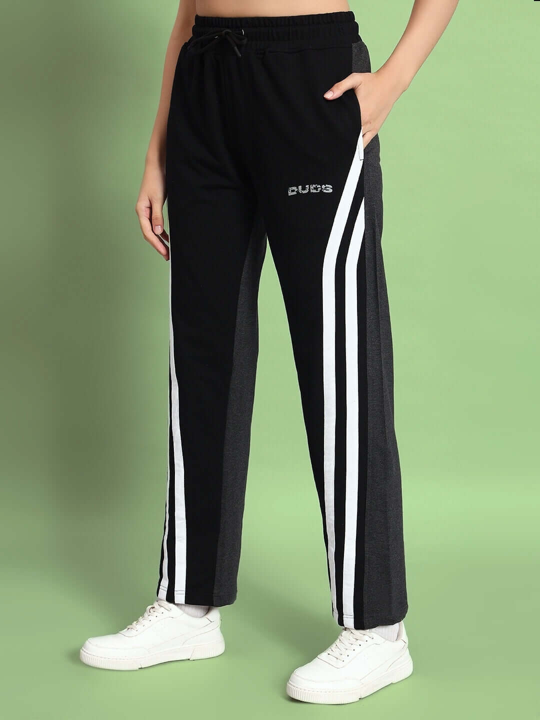 Women's black and grey skater Korean baggy joggers by DUDS with sporty white stripes and a relaxed fit.