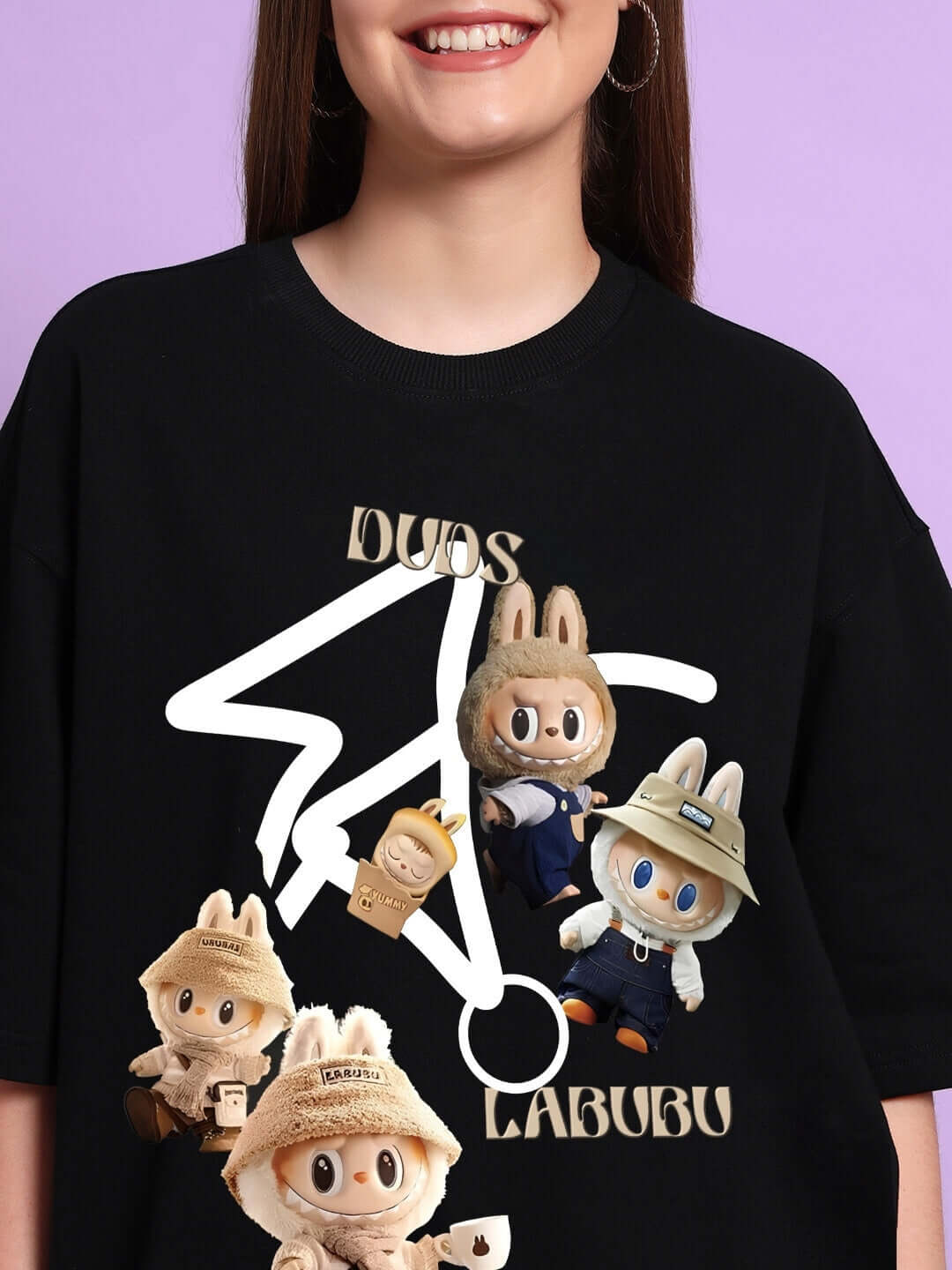 Black oversized T-shirt with Labubu gang print featuring characters, made from premium cotton. Ideal for casual wear.