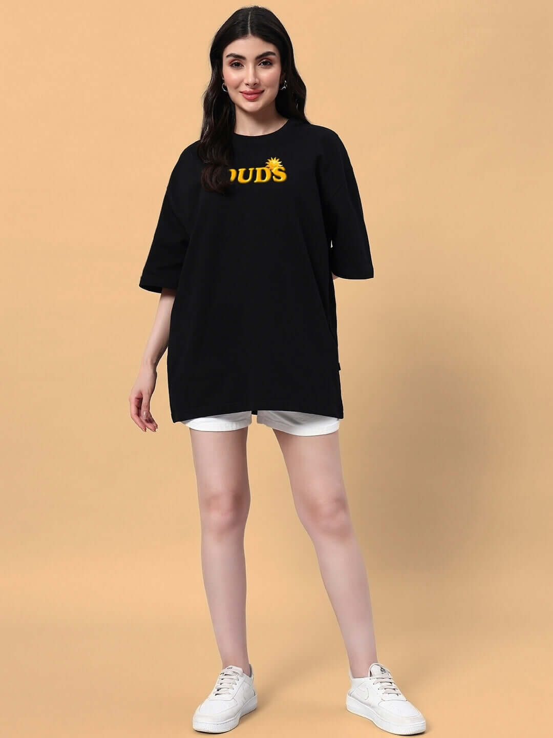 Model wearing Women's Labubu Monsters oversized black t-shirt paired with white shorts, showcasing a trendy and relaxed summer look.