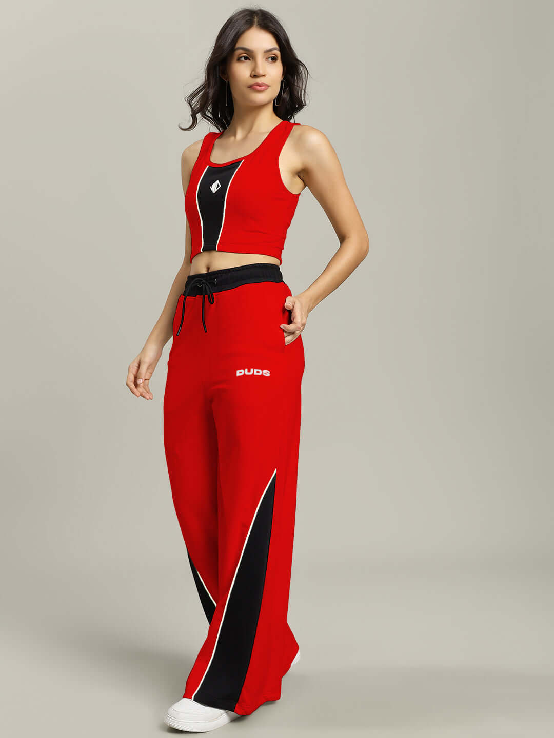 Woman wearing red-black Larissa co-ord set made from premium heavy gauge fabric, featuring modern design and casual fit.