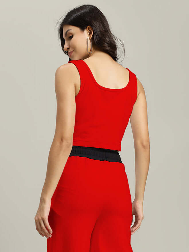 Back view of model wearing WOMEN LARISSA CROP-TOP RED-BLACK showcasing color-block design