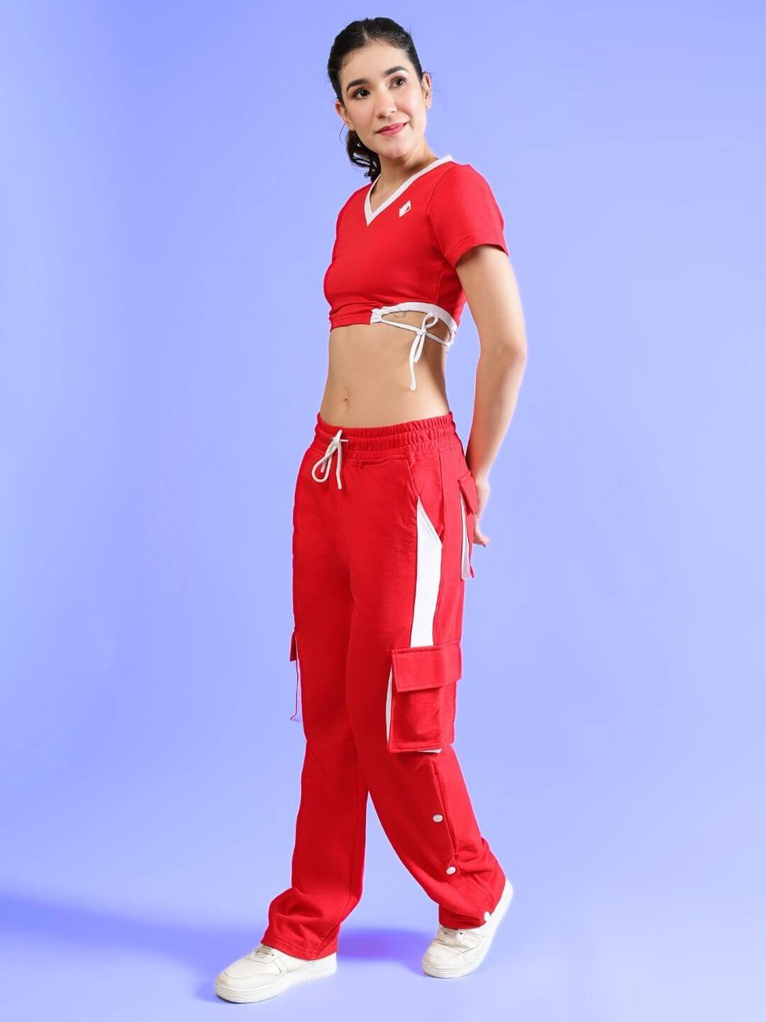 Woman wearing WOMEN'S LERISA ACTIVE CO-ORD SET RED, sporty outfit by WEAR DUDS, vibrant red, comfortable cotton-blend fabric