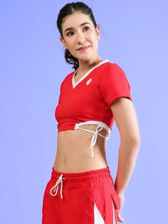 Model wearing Women's Lerisa Fitted Crop Top in Red, showcasing premium cotton blend and design. Perfect for stylish, comfortable outings.