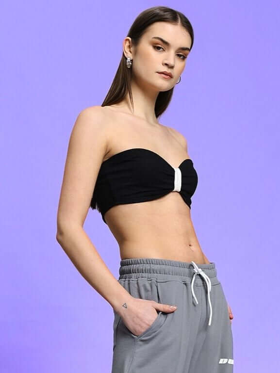 Model wearing WOMEN'S LIA CO-ORD SET BLACK GREY by WEAR DUDS in black bandeau top and grey pants, showcasing modern streetwear style.