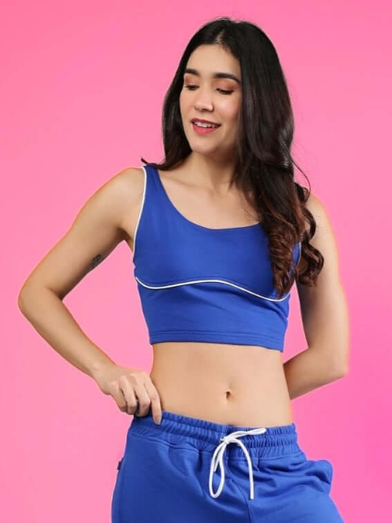 Women's Lias fitted crop top in royal blue, premium cotton French terry, bio-washed for comfort and style, model in casual pose.