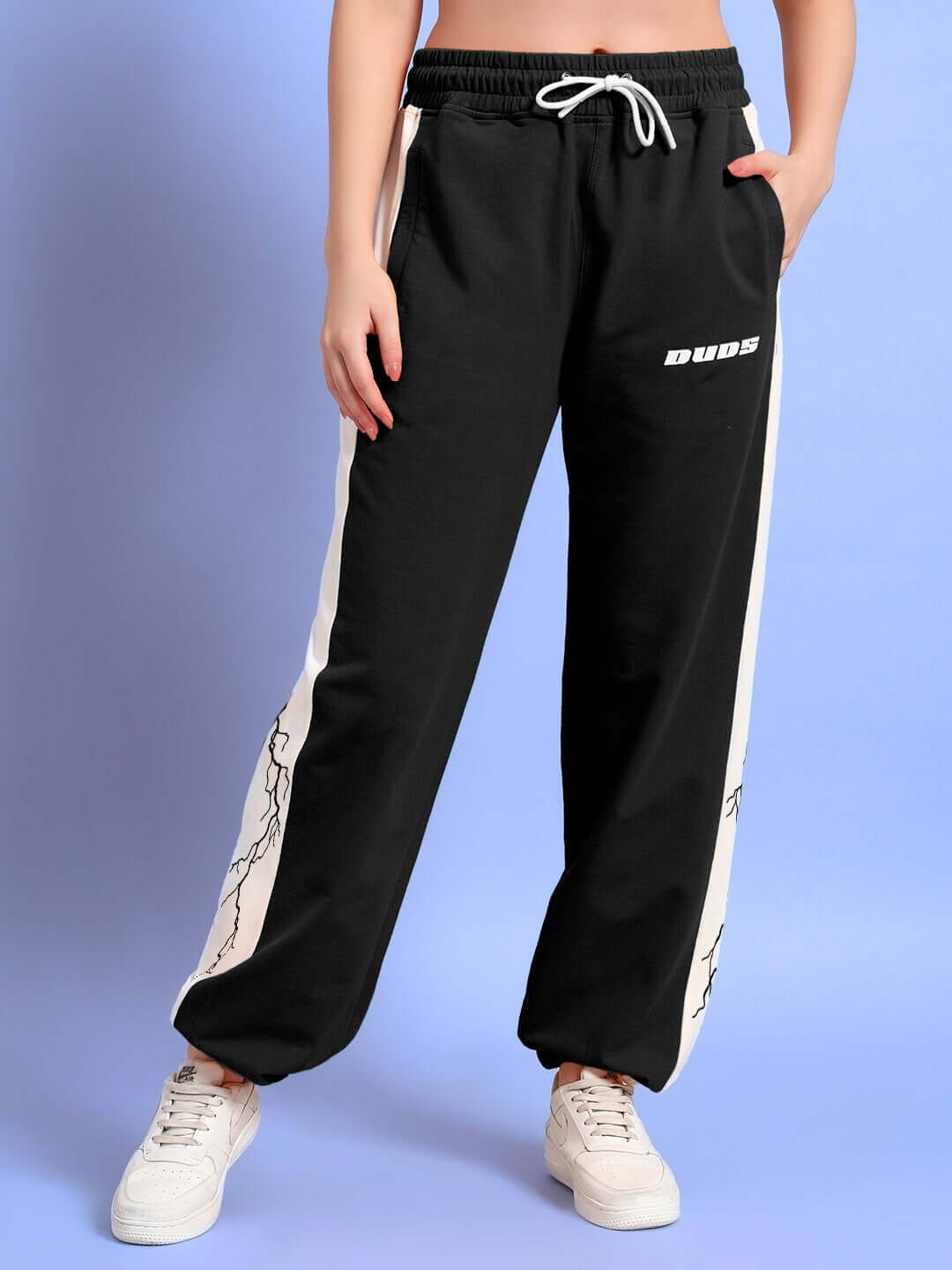 Women's black and white lightning bolt joggers, relaxed fit, by DUDS featuring side pockets and elastic waist.