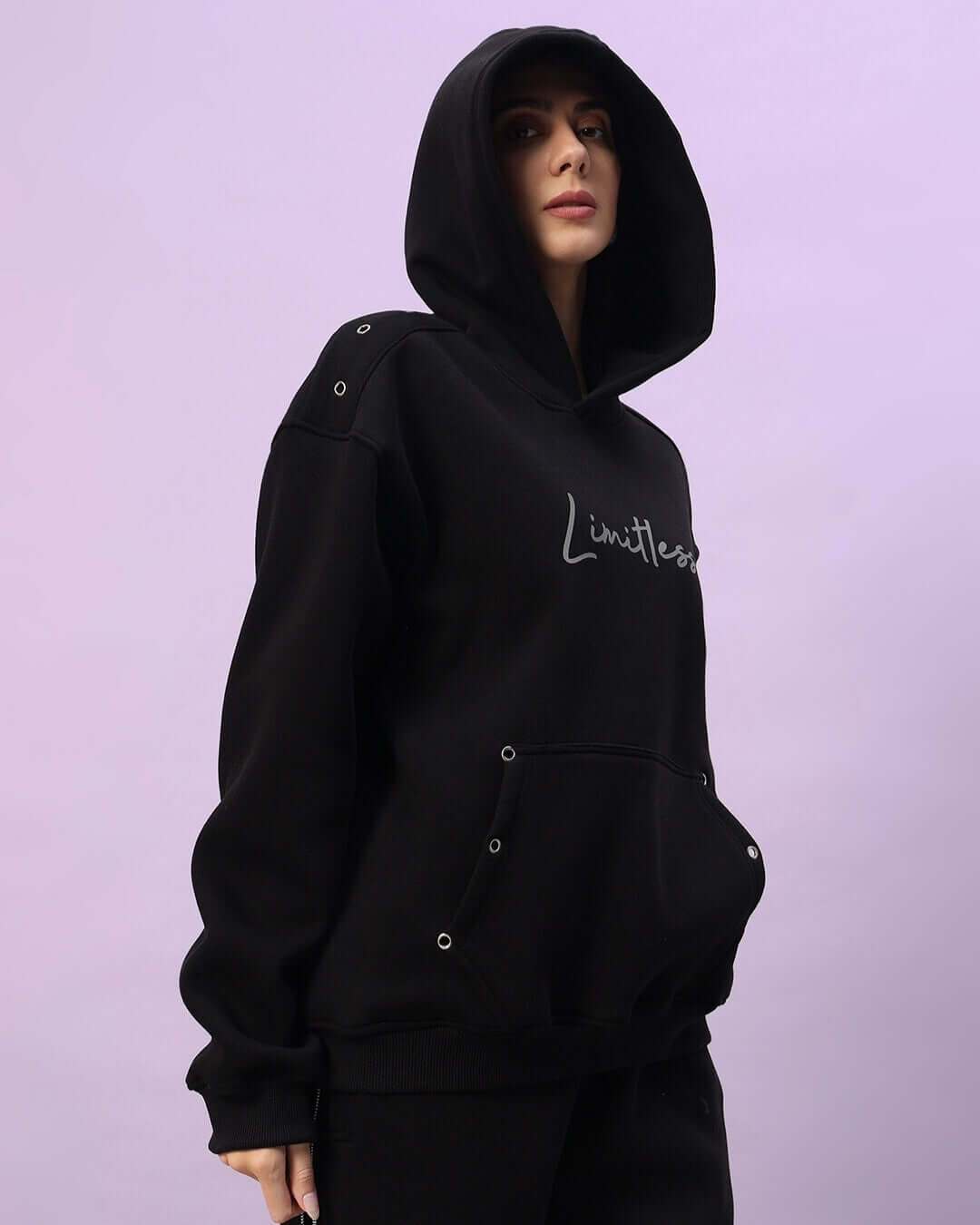 Black women's Limitless Fleece Reflector Hoodie with modern reflective details for comfort and style.