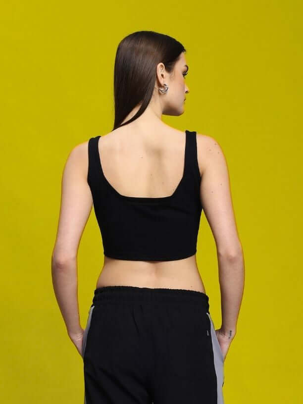Back view of model wearing Women's Linna Crop-Top in black, made of premium 100% cotton fabric, styled for casual elegance.
