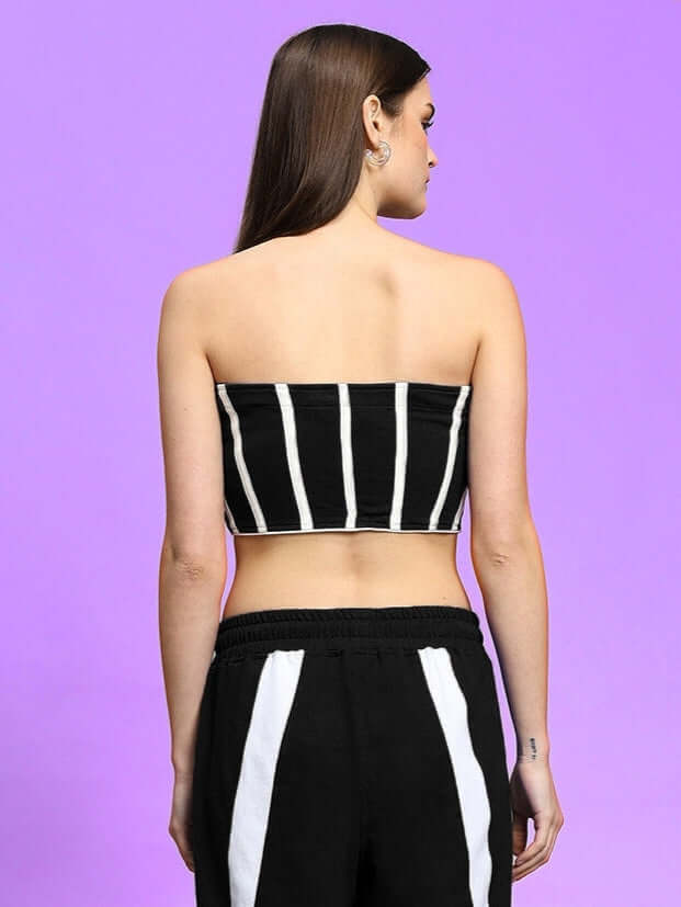 Back view of model wearing black and white striped LiviAna Cool Bandeau top made of premium cotton fabric, styled with matching pants.