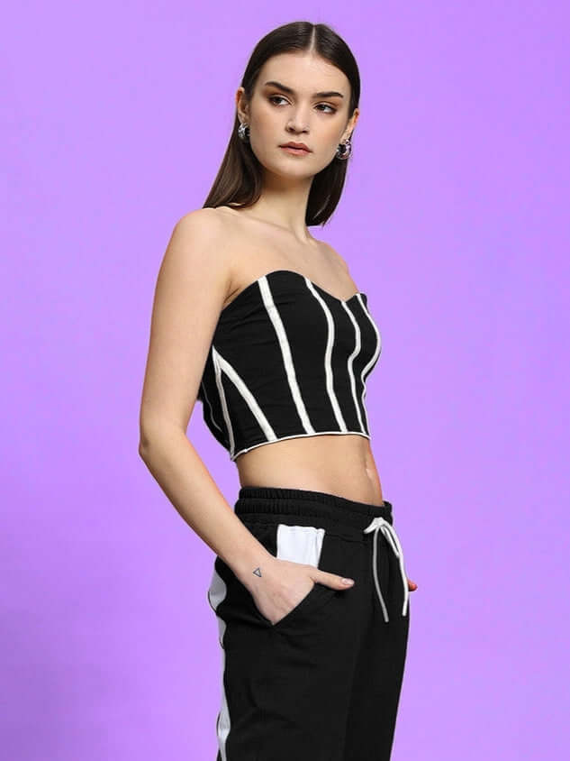 Model wearing Women's Liviana Cool Bandeau Top in black with vertical stripes, made from premium cotton, showcasing stylish casual wear.
