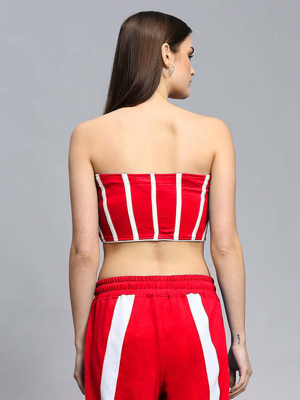 Back view of woman's red and white striped bandeau top with matching pants, highlighting the casual and stylish summer outfit.