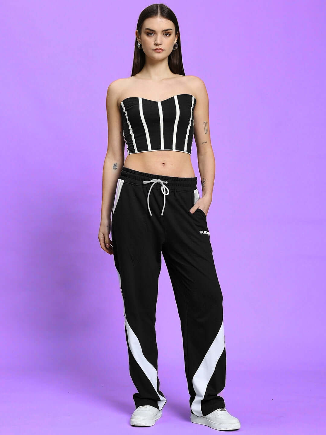 Model wearing WOMEN'S LIVIANA COOL CO-ORD SET BLACK by WEAR DUDS, featuring a chic, minimalistic design perfect for streetwear elegance.