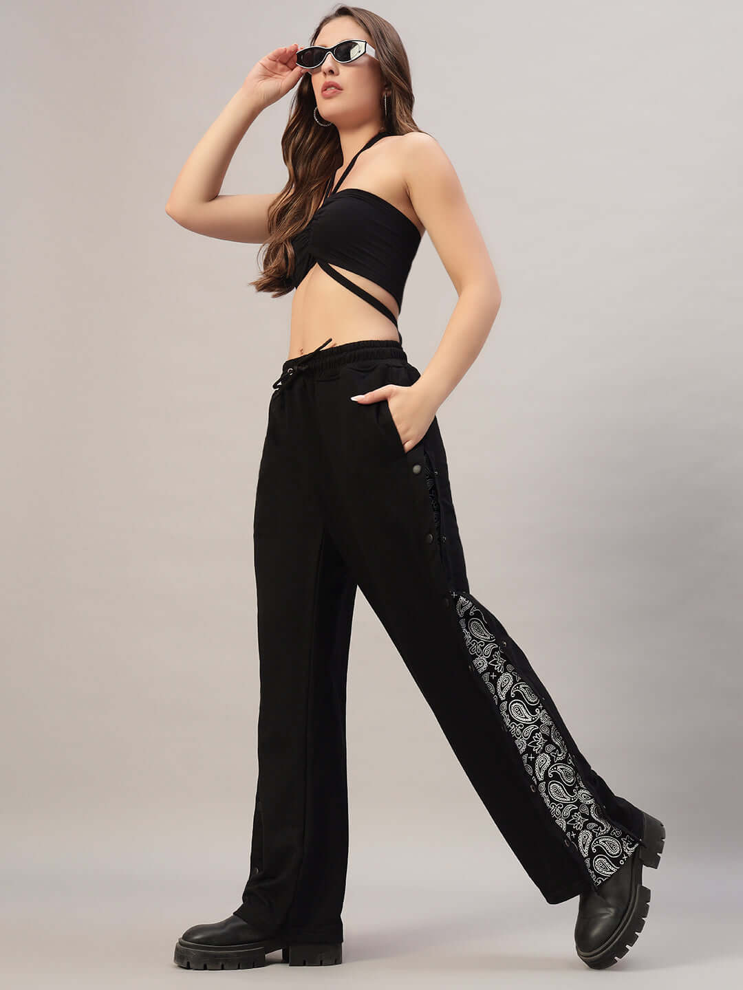 Model wearing Women's Mambo Joggers in Black, with custom fit option and stylish design, by DUDS, perfect for a chic casual look.