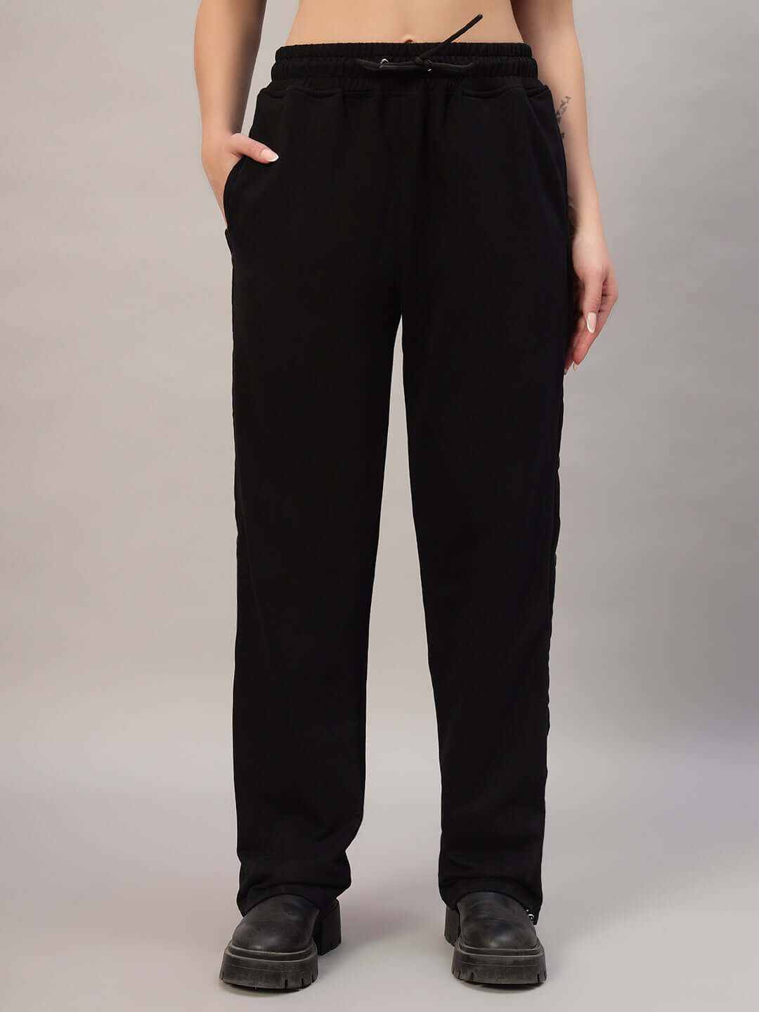 Women's black Mambo joggers by DUDS, featuring a relaxed fit, customizable size option, and crafted by skilled tailors.