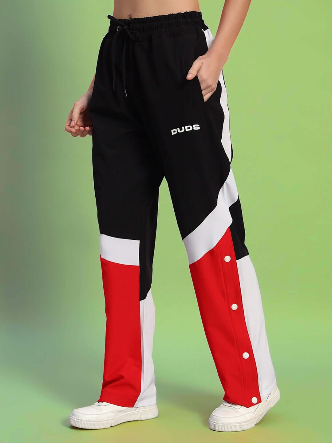 Women's relaxed fit cargo pants in black, red, and white with pockets, customizable size options, and DUDS logo displayed.
