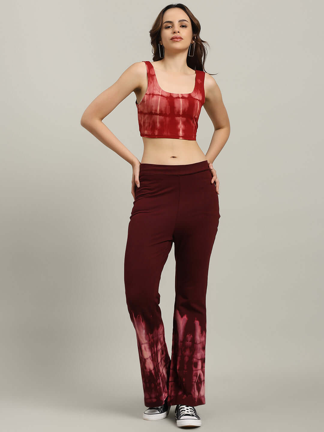 Model wearing WOMEN'S MEMORIA TIE-DYE CO-ORD SET MAROON, including crop-top and joggers, showcasing trendy streetwear style.