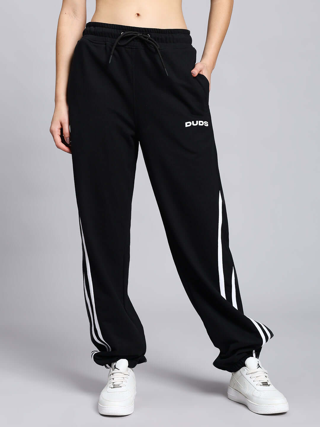 Women's Megastar 2 Stripe Jogger in black from DUDS, featuring white stripes and a relaxed fit, ideal for customizable comfort.