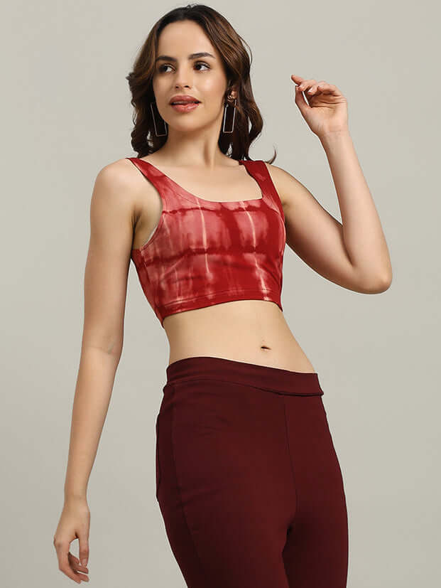 Woman wearing a maroon tie-dye crop-top crafted from premium heavy gauge fabric.