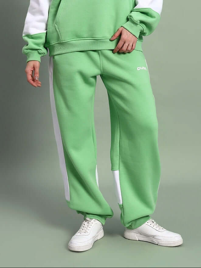 Stylish WOMEN MINTED BLISS FLEECE CARGO PANT GREEN WHITE with elastic waistband and pockets, perfect for streetwear style.
