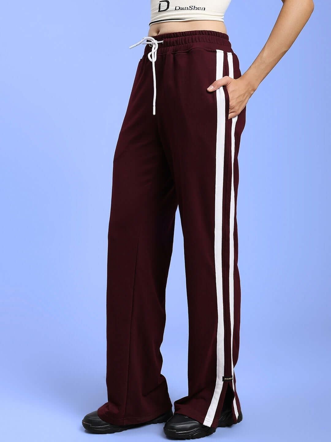 Women's Moscow relaxed fit maroon joggers with white side stripes, featuring a drawstring waist, suitable for casual and comfortable wear.