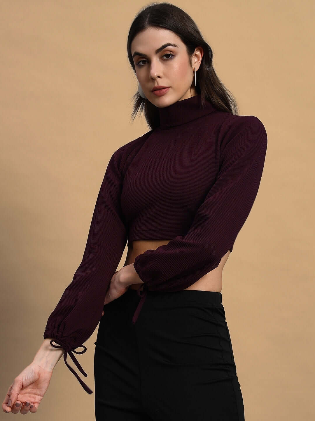 Model wearing women's muffine ribbed crop top in wine, premium lycra fabric, turtleneck design, long sleeves.