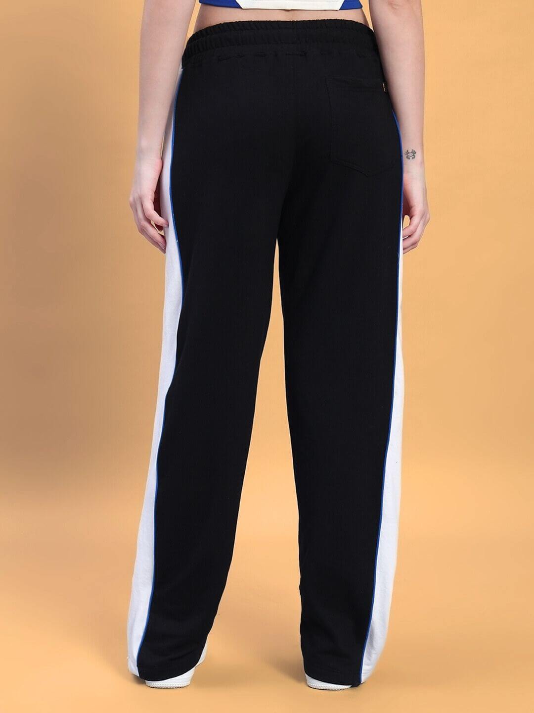 Back view of WOMEN'S MYSKY CO-ORD SET WHITE ROYAL BLUE pants with sleek royal blue and white accents, showcasing modern sporty style.