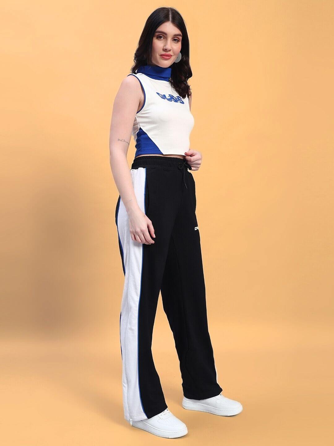 Model wearing WOMEN'S MYSKY CO-ORD SET WHITE ROYAL BLUE, showcasing sporty and sophisticated style with bold royal blue and white design.