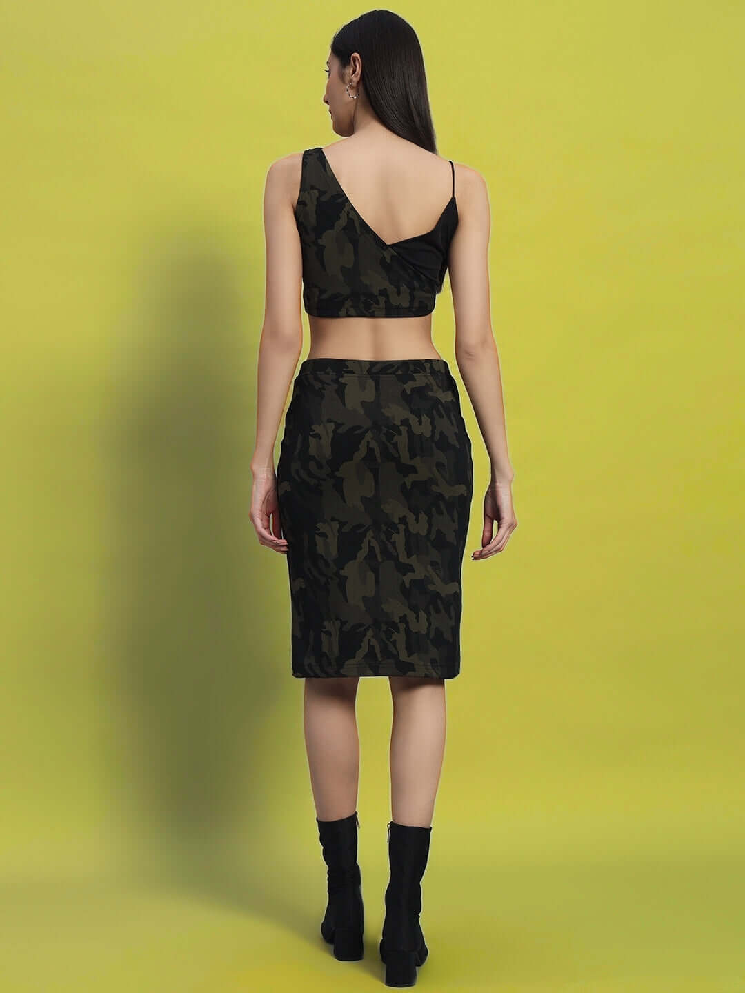 Back view of a woman wearing the WOMEN'S NAIROBI CO-ORD SET CAMO GREEN, showcasing the camo design and fit.