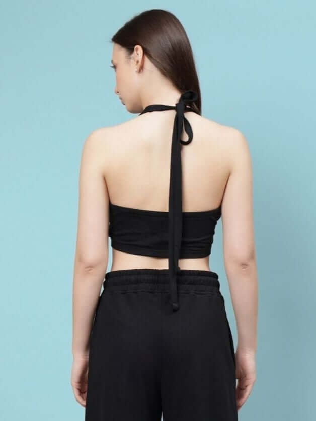 Back view of woman wearing a black crop-top made of 100% cotton, premium heavy gauge fabric, 240 GSM, by Color By Colours.