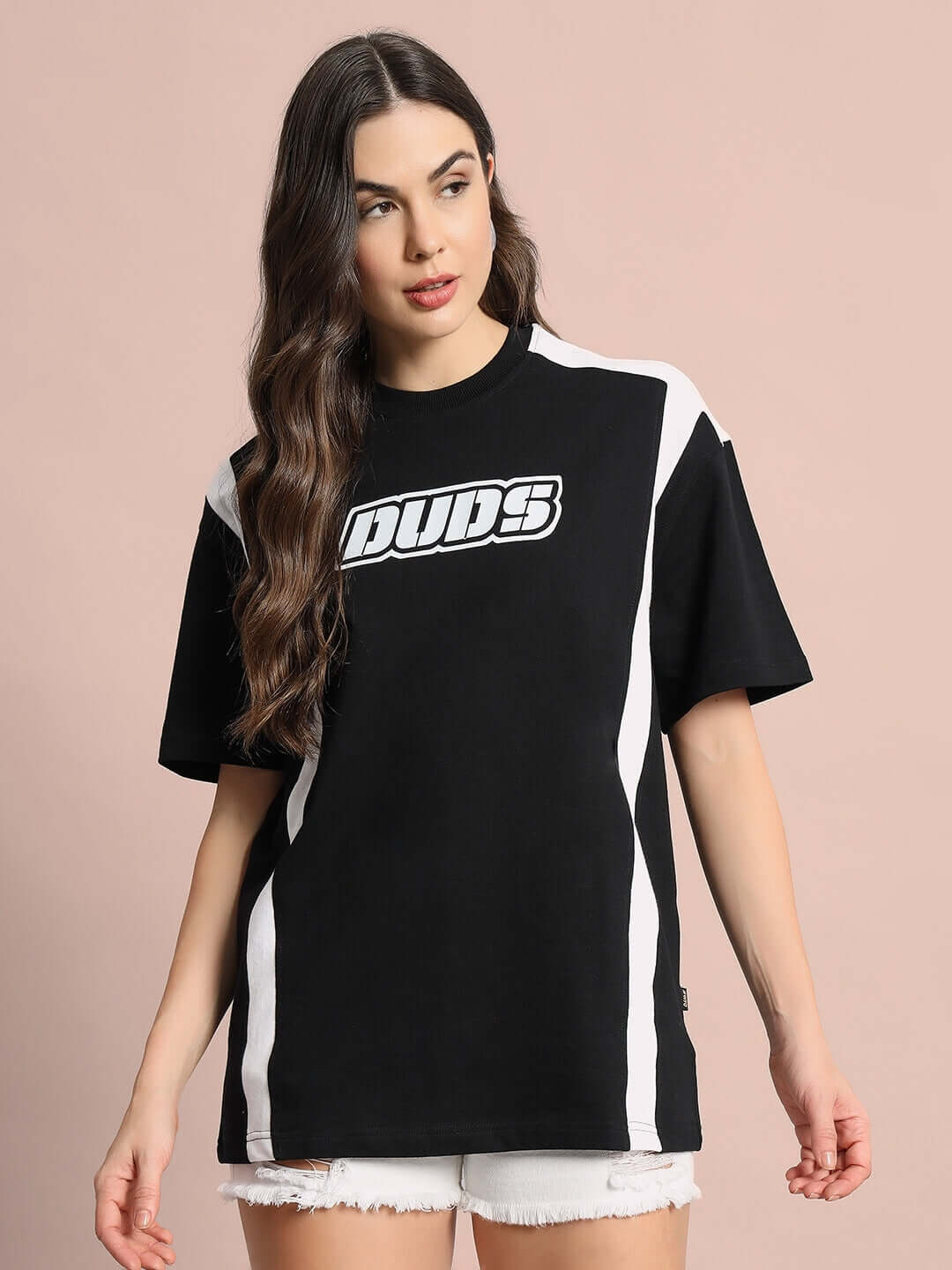 Model wearing oversized black Women's Ninja Storm T-shirt made with premium cotton and elastane, highlighting stylish design and comfort.