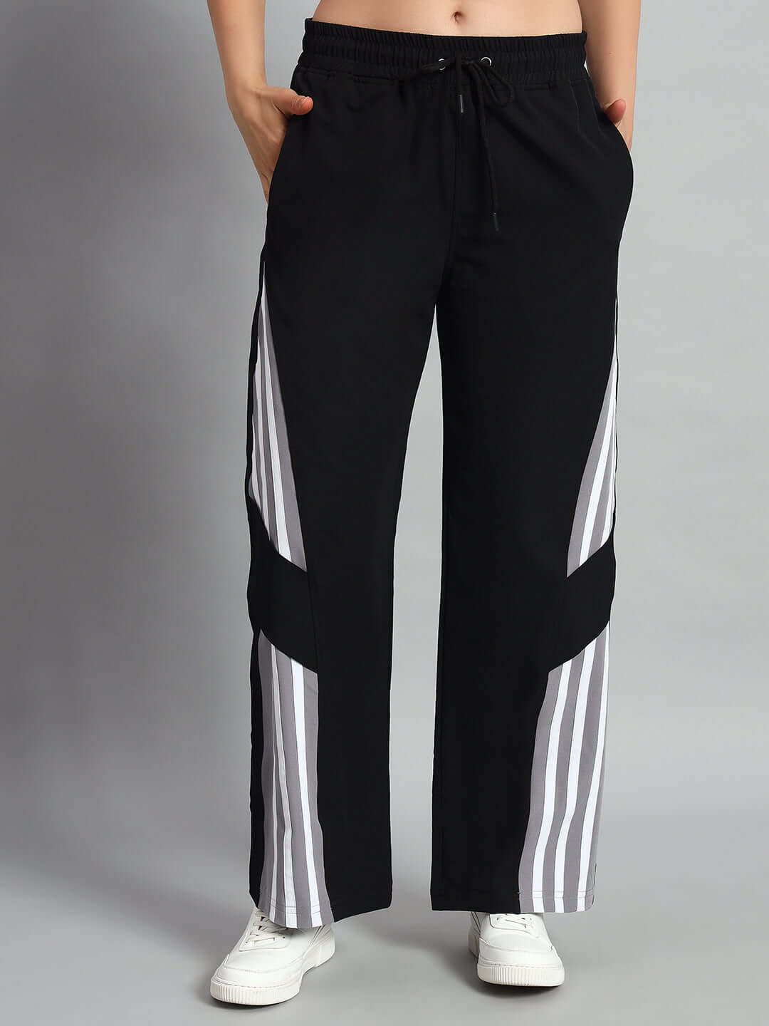 Black women's relaxed fit cargo pants with custom fit option, featuring side stripes. Available for prepaid orders with custom sizing.