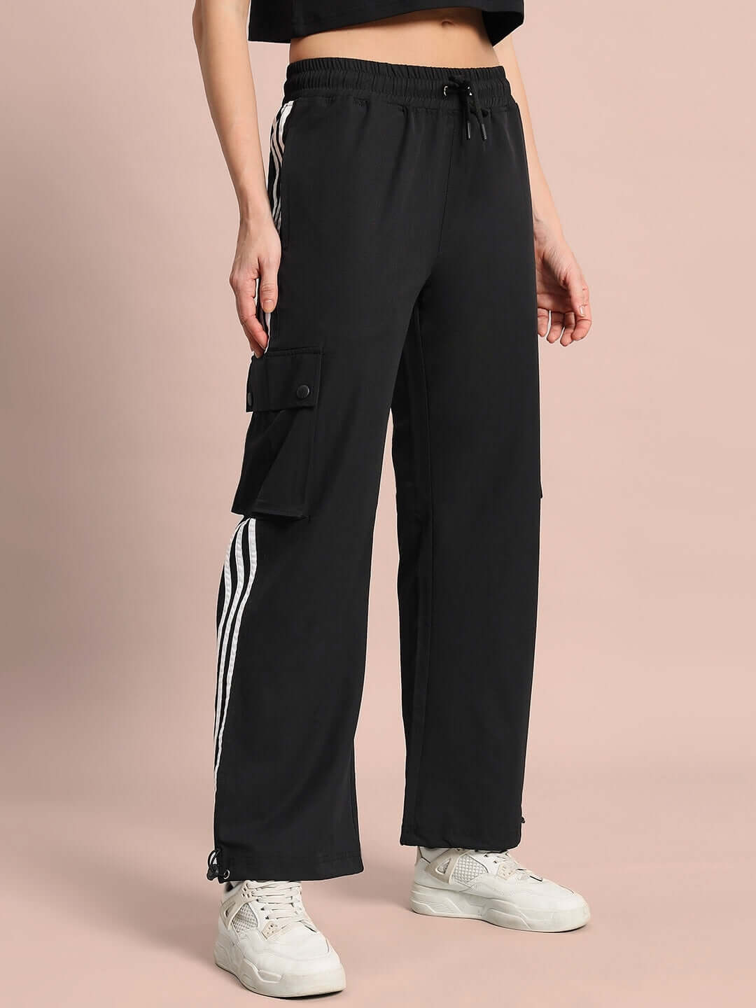 Women's Nova Relaxed Fit Cargo Pants in black with custom fit option, side pocket, and stylish white stripe detailing.