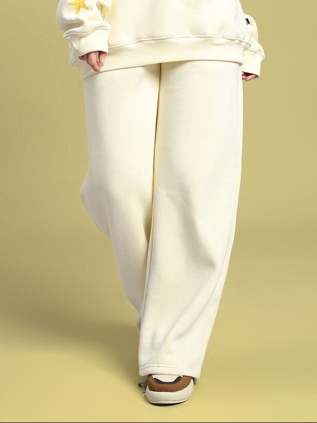 Woman wearing WOMEN'S OCEAN BUDDIES JOGGER OFF-WHITE, showcasing comfort and style with ocean-inspired details.