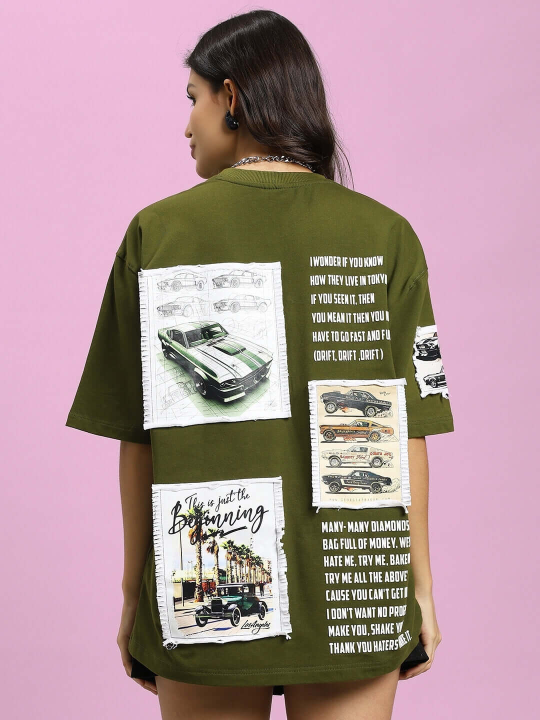 Rear view of women's olive green oversized Ford Mustang T-shirt with vintage car prints and text graphics, made from premium cotton.