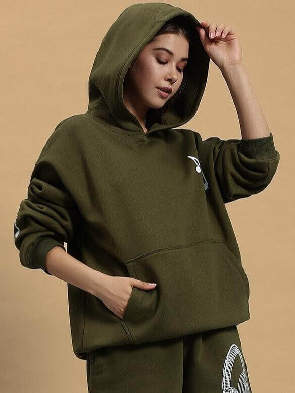 Stylish WOMEN OPERA FLEECE HOODIE OLIVE GREEN worn by model, featuring cozy fit and hoodie design for fashion-forward look.