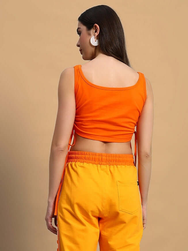 Alt Tag: Women's orange crop top, back view, made of 100% cotton, perfect for casual wear with vibrant style and comfortable fit.
