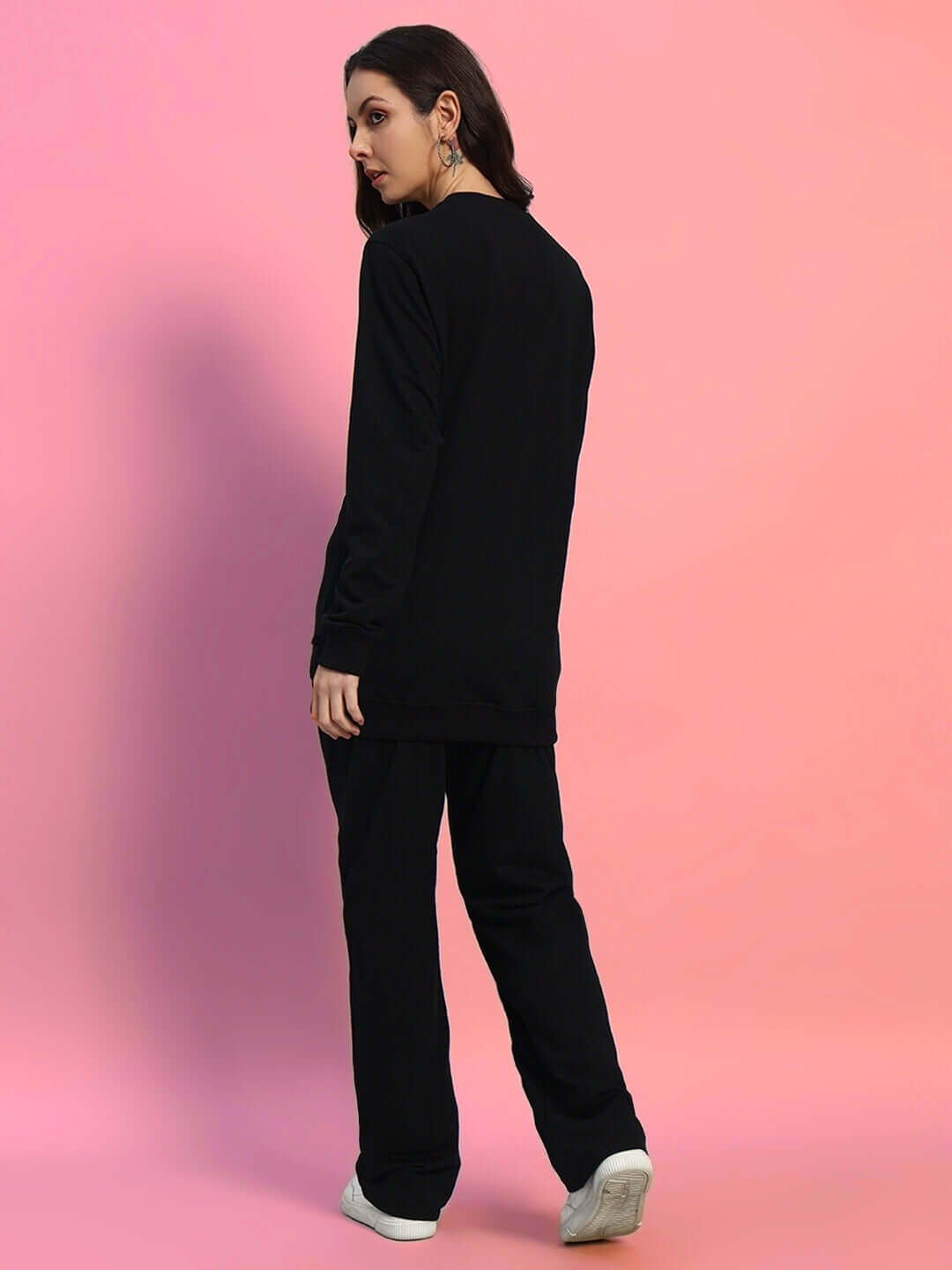 Woman wearing WOMEN'S OUTLOOK CO-ORD SET BLACK WITH WHITE STRIPE in pink background